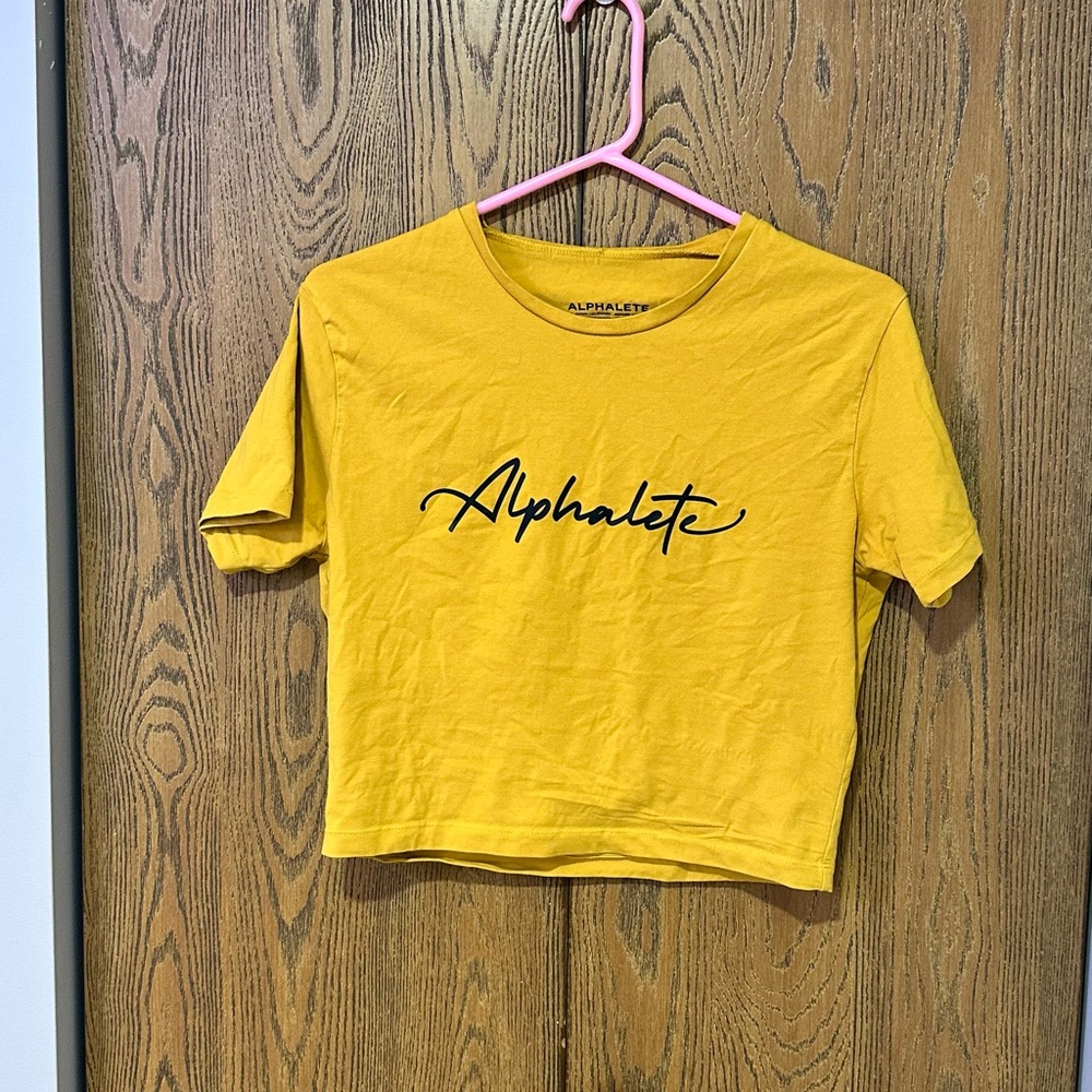 Alphalete Mustard Yellow Script Logo Crop Tee